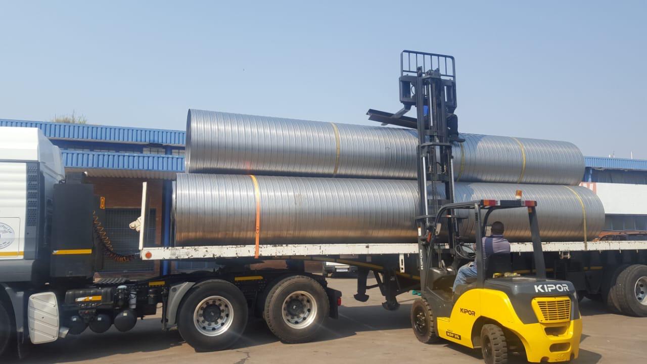 Spiral ducting loaded for delivery to a commercial site.