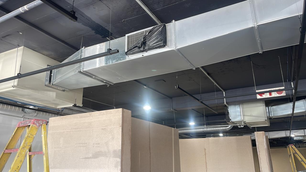Rectangular ducting and equipment above new partitioning.
