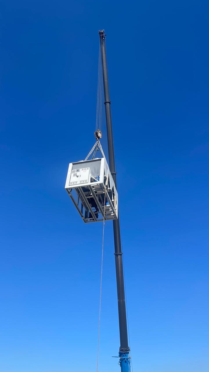 Air-cooled chiller lifted to the rooftop.